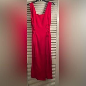 Holiday or homecoming dress! Beautiful red dress with front slit.